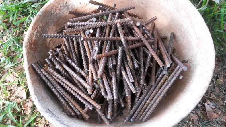 pre-cut all iron rods to identical length using metal cutter, saw or angle grinder.